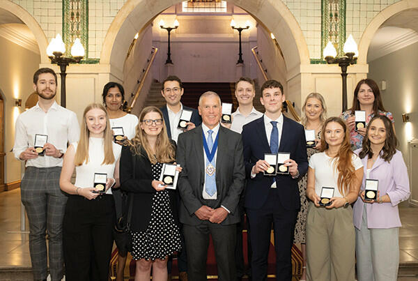 The then ATT President Simon Groom with the prize winners from the May and November 2023 sittings of the ATT examination.